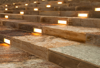 a marble staircase with built in stair lights at a commercial business